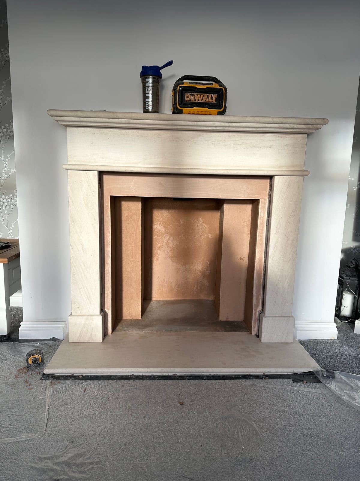 Traditional stone fireplace mantel during installation