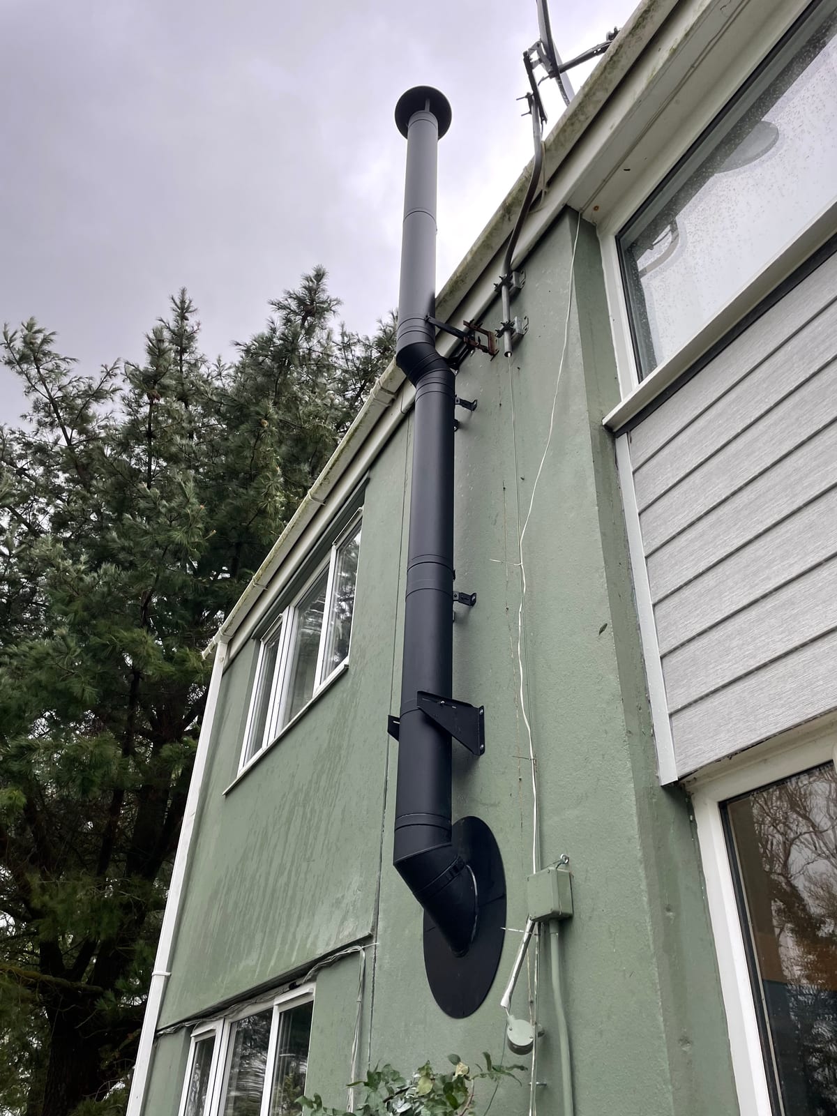 External twin-wall flue installation on a residential property